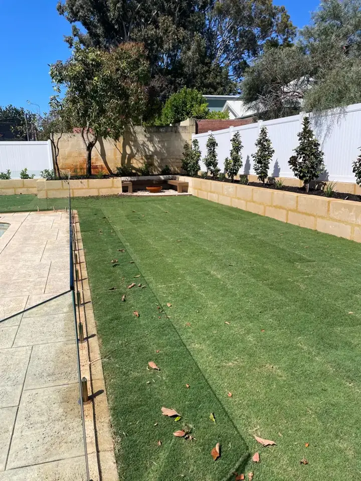 Limestone retaining wall and planter with new turf